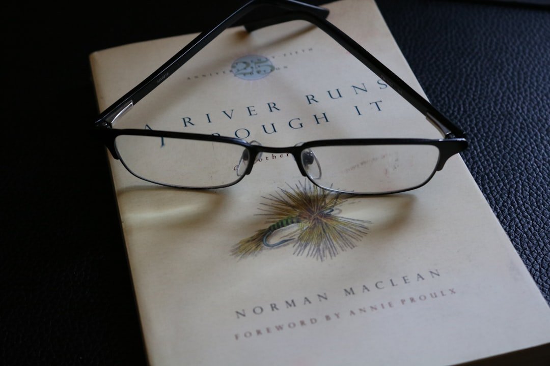 Book with reading glasses on top, ready for a reader