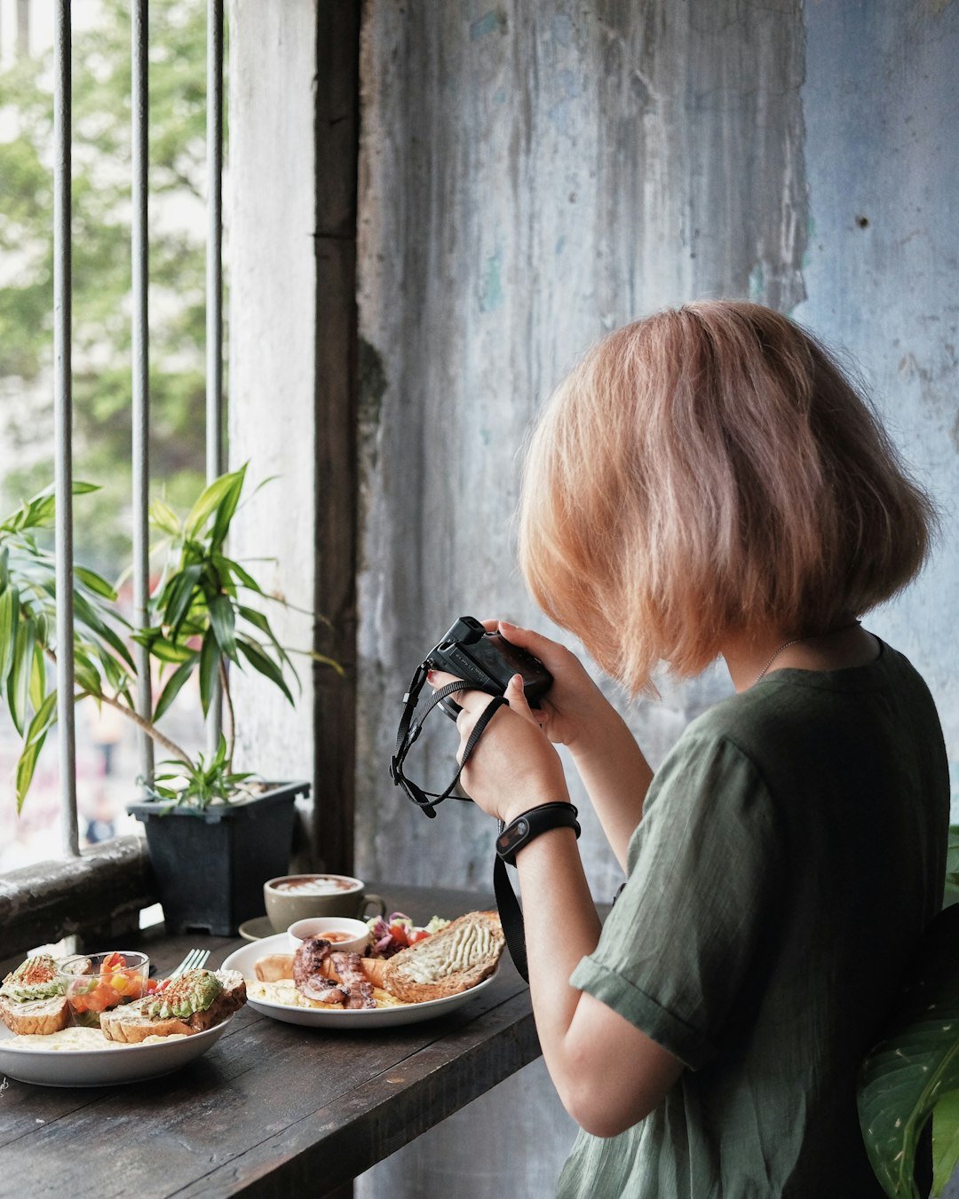 Food blogger taking a photo of a dish for social media
