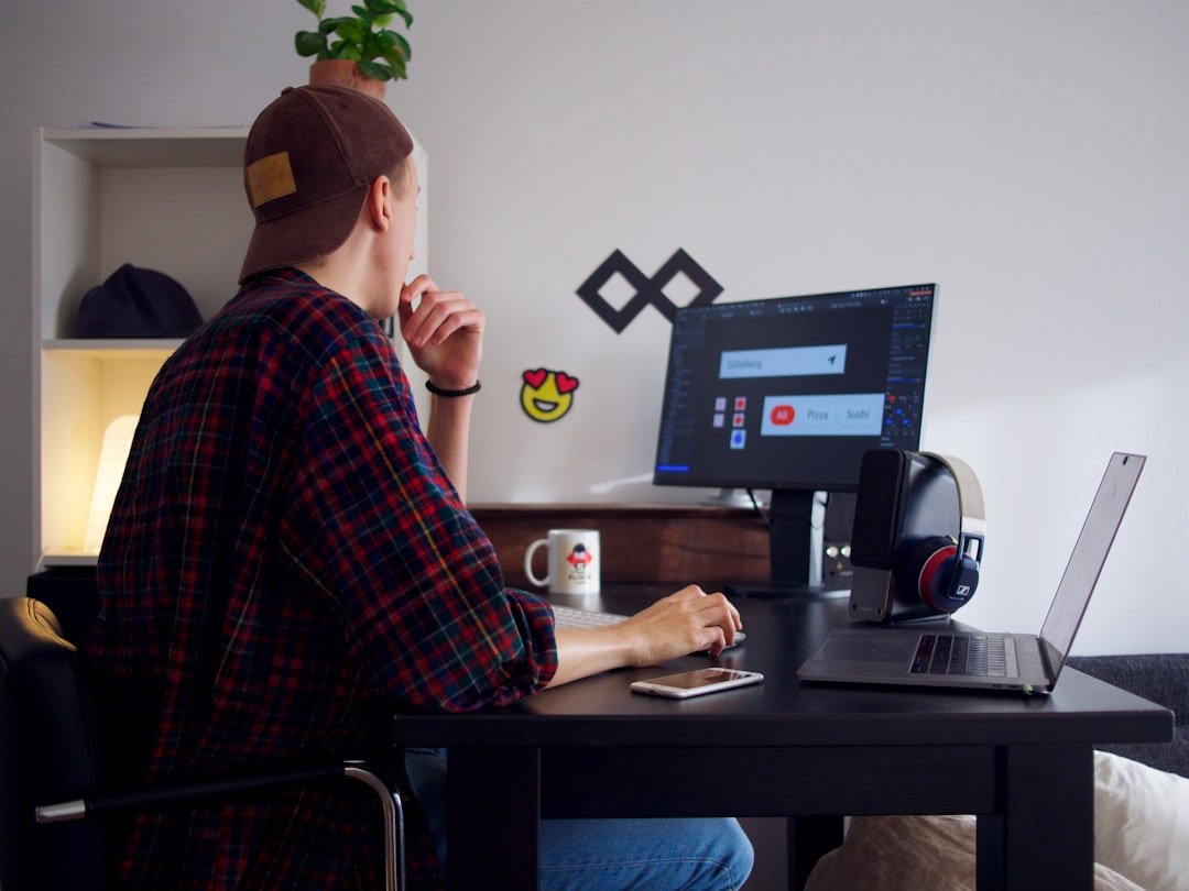 Freelancer sitting at a table using a computer for client work