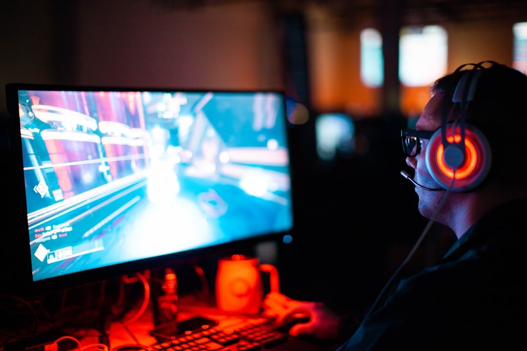 Gamer using a computer to play an FPS game during a stream