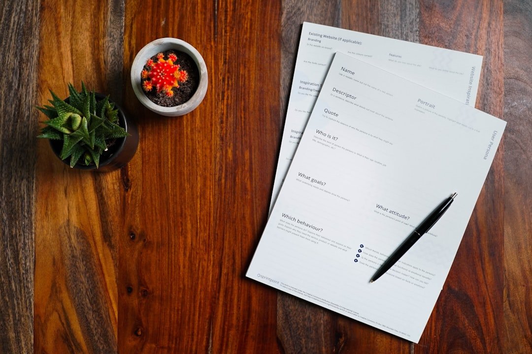 Papers and a pen on a table, illustrating keeping records of SMM panel order confirmations