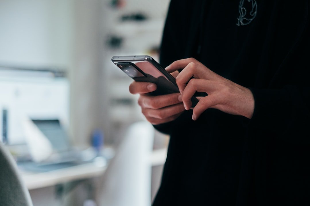 Person checking phone carefully before trusting an SMM panel