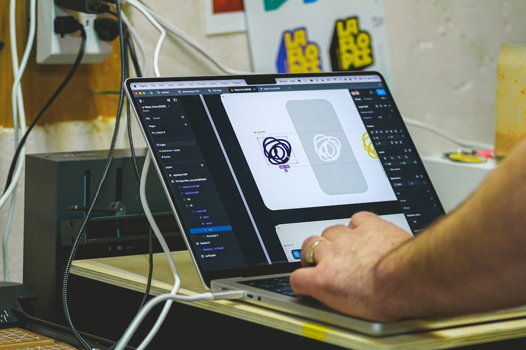Person designing a brand identity on a laptop computer screen