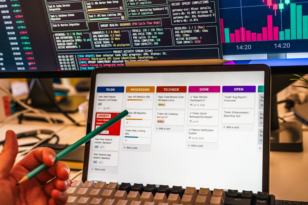 Person pointing at a digital dashboard interface on a tablet screen
