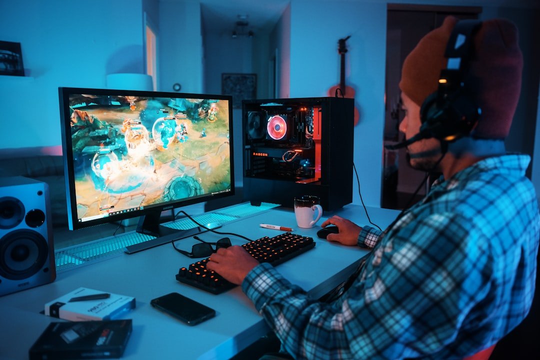 Person wearing headphones using a computer, chatting in an online community