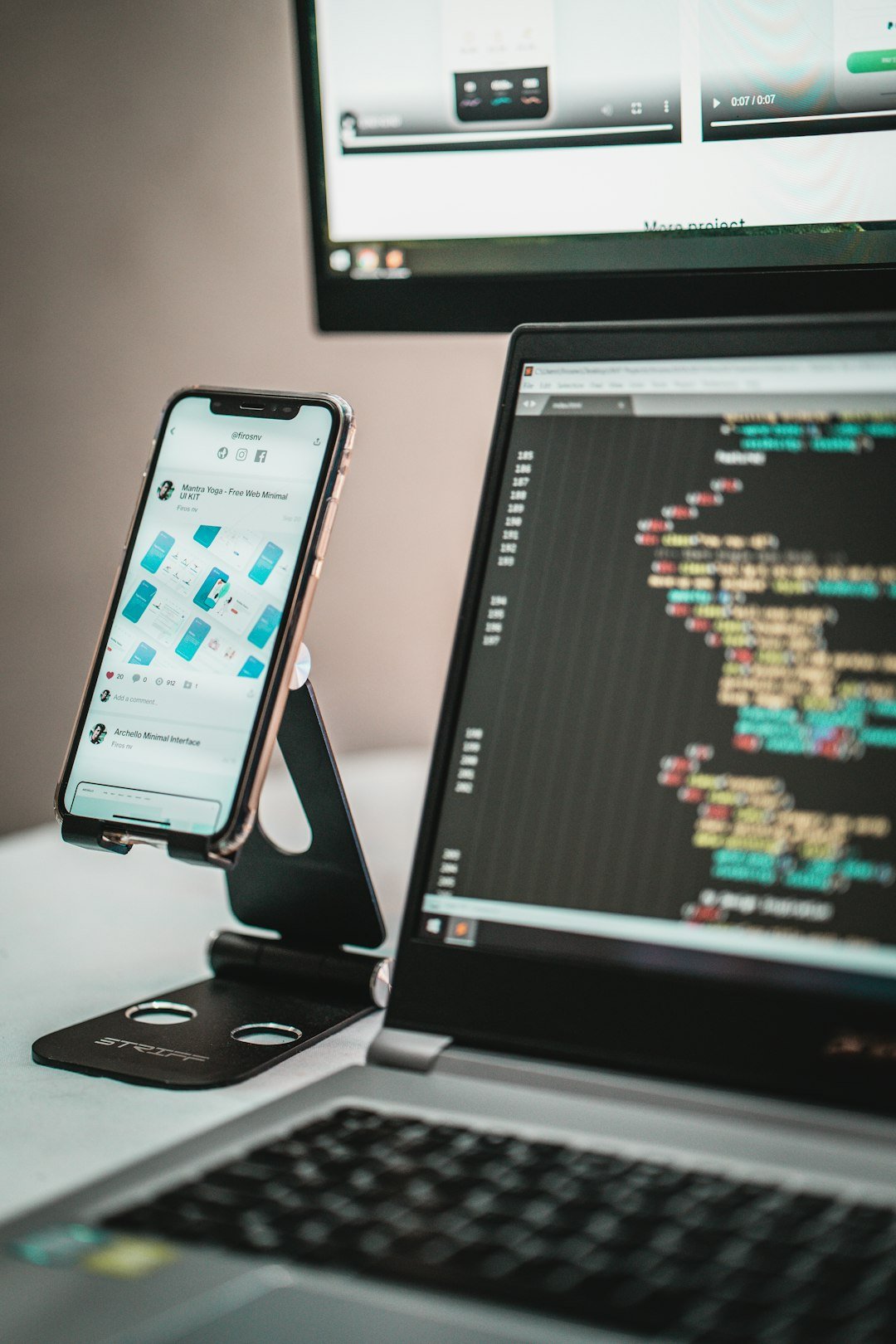 Smartphone on a laptop, representing an app launch and promotion