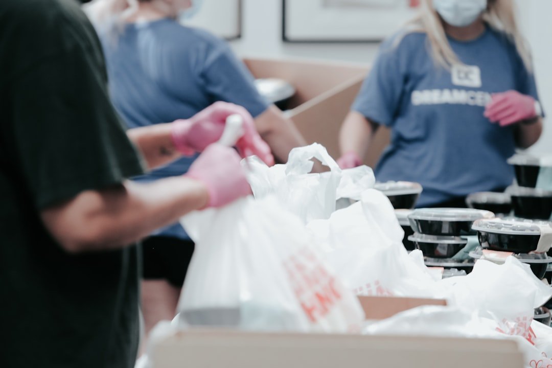 Volunteers packing food into bags for a community charity drive