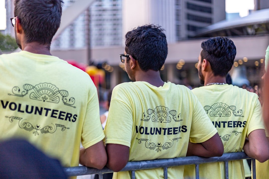 Volunteers wearing shirts working together for a non-profit cause